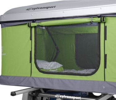Optima camper with green and gray exterior for outdoor adventures.