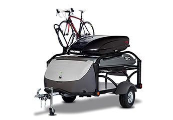 Compact camping trailer with bike rack and storage for outdoor adventures.