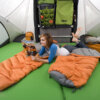 woman laying down on top bed panels