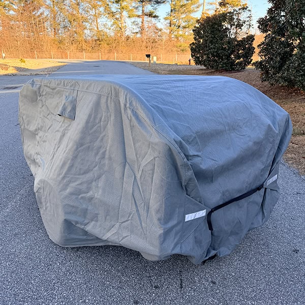 Tyvek cover protecting GO & GOAT popup campers from weather elements.