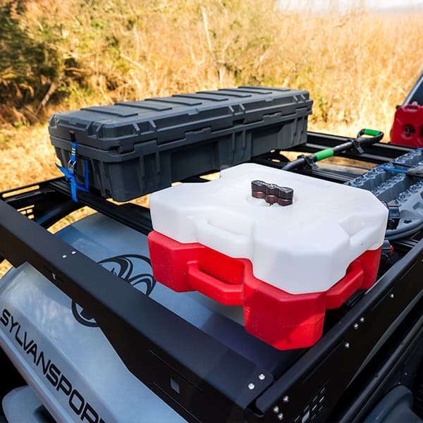 Durable DuraDeck storage box mounted on SylvanSport trailer for outdoor adventures.