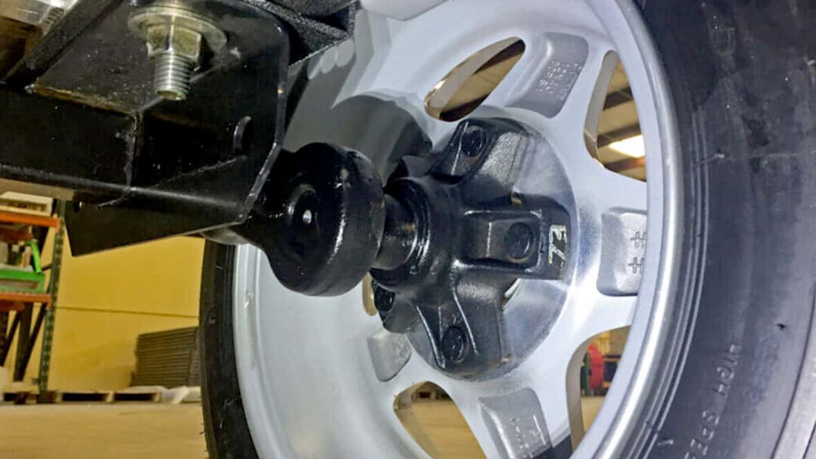 Wheel and axle close-up for kayak trailer.