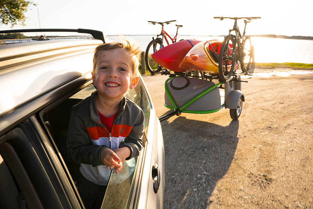 kid with kayak trailer