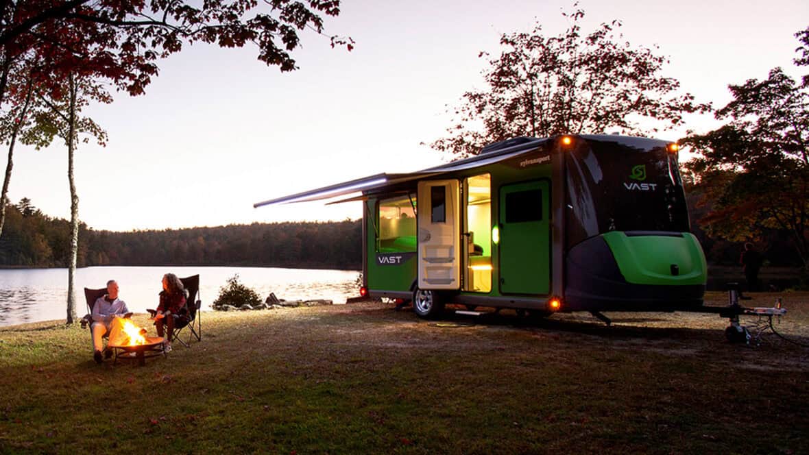 SylvanSport VAST camper for sale at sunset by a lake.